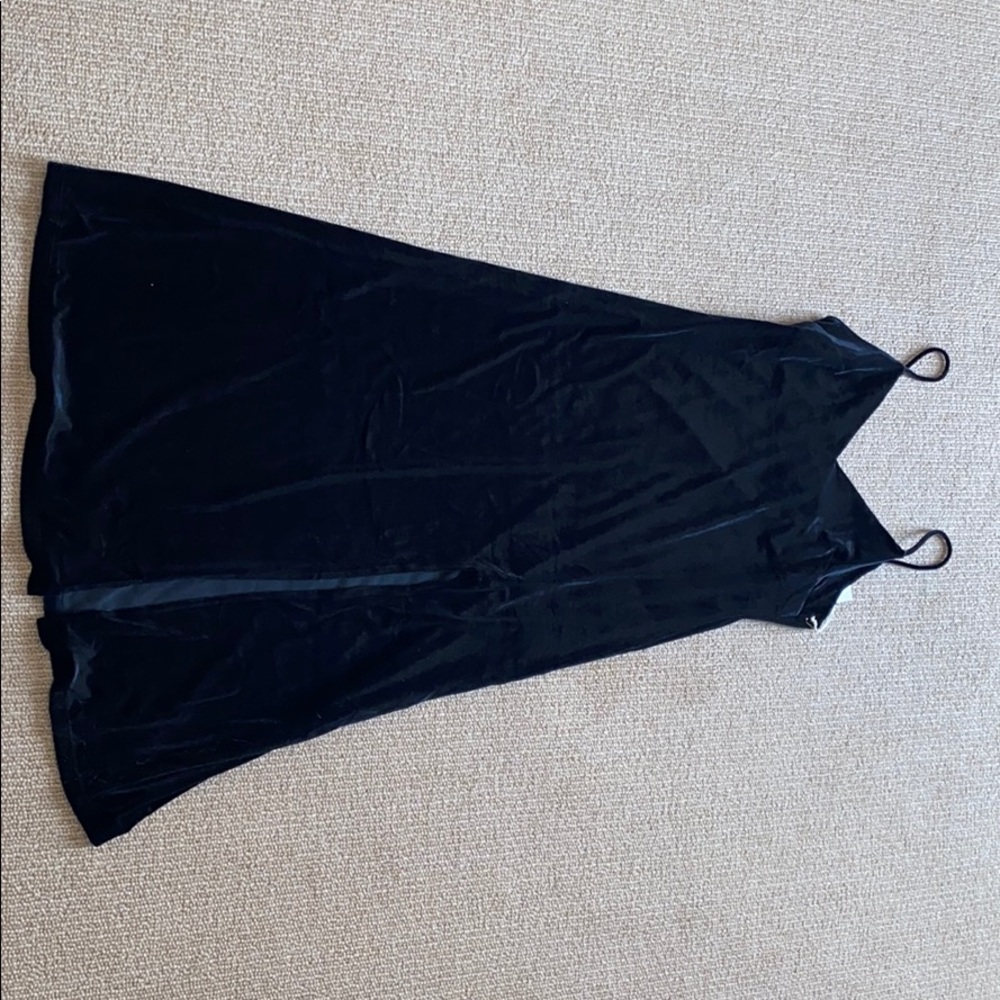 Black strappy dress, left leg slit